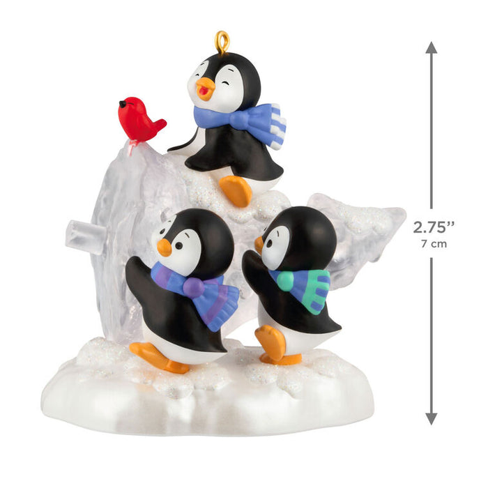 Decorative penguin figurine with a bird on a white background