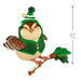 Decorative bird figurine wearing a green outfit and hat on a branch with a measurement label.