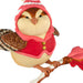 Bird figurine wearing a red outfit with a hat on a white background