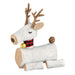 Decorative reindeer figure made of logs with a plaid collar and pine cone on a white background