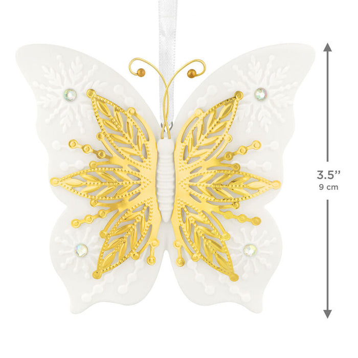 Butterfly-shaped decorative item with gold and white design, featuring measurements on a white background.