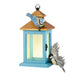 Blue birdhouse ornament with two birds on a white background