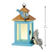 Decorative birdhouse with birds ornament on a white background