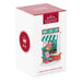 Hallmark Keepsake Ornament Club Christmas ornament packaging with a girl in front of a store.