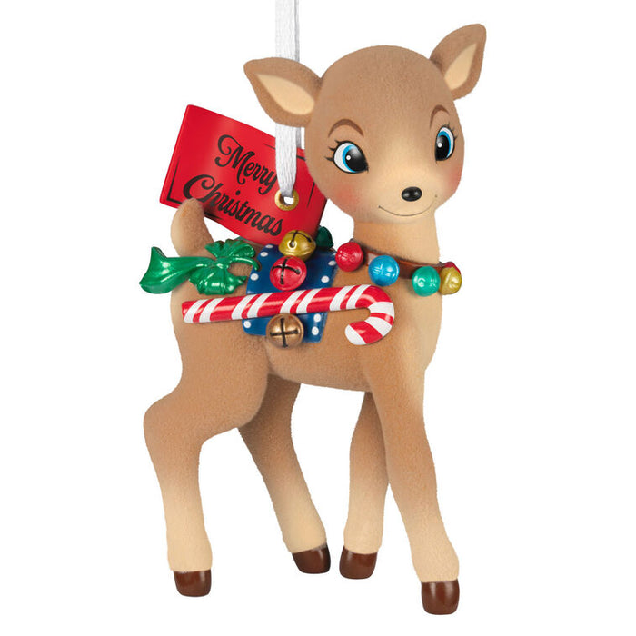 Christmas reindeer ornament with candy cane and bell decorations on a white background