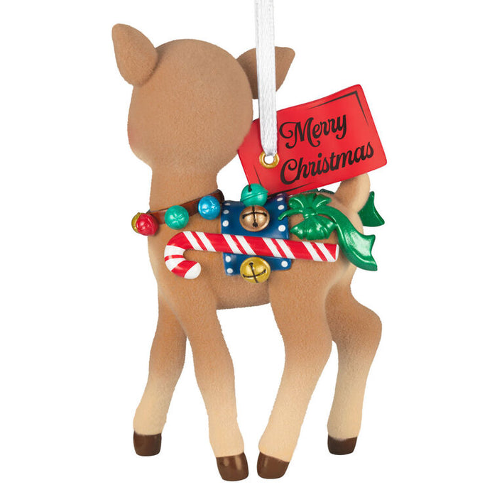 Christmas reindeer ornament with candy cane, bells, and 'Merry Christmas' tag on a white background