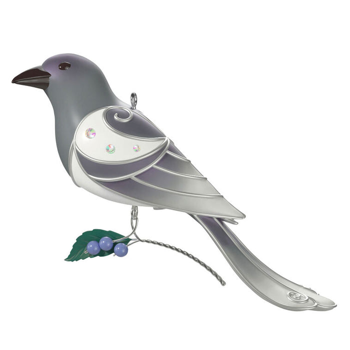 Decorative bird ornament with a white body and gray wings on a white background