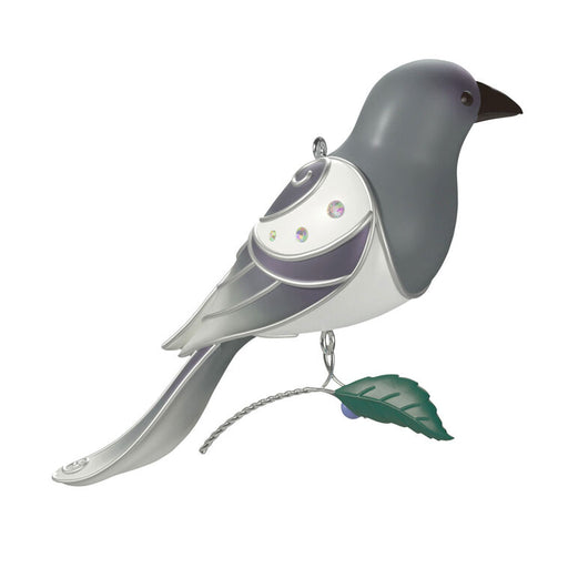 Decorative bird ornament with a white chest and gray back on a white background