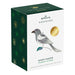 Hallmark Keepsake Christmas ornament packaging with a ghost magpie design on a white background