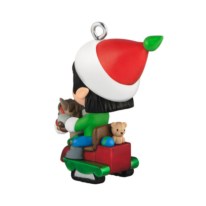 Christmas ornament with a character in a red hat and green outfit on a white background