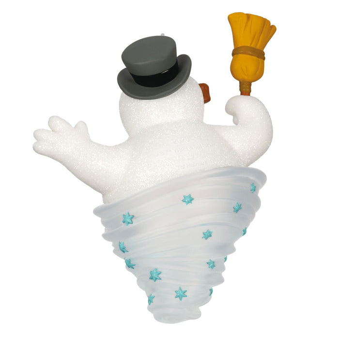 Snowman figurine with top hat, broom, and star-patterned outfit on a white background