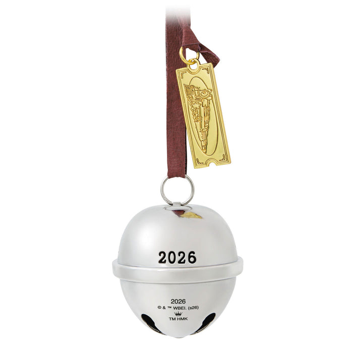 Silver bell ornament with '2026' on a white background
