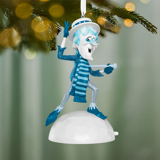 Decorative Christmas ornament of a character in a blue and white outfit hanging from a tree.