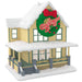 Model of a house with a Christmas wreath and 'A Christmas Story' text on a white background