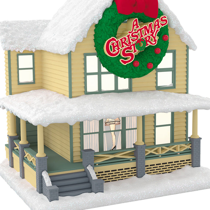 Model of a house with a Christmas wreath and 'A Christmas Story' text on a white background