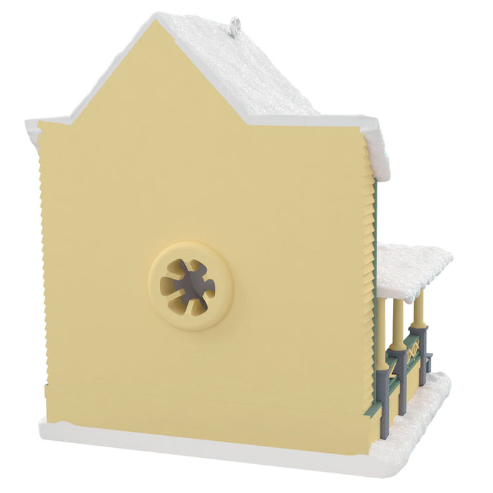 Model of a yellow building with a white roof on a white background