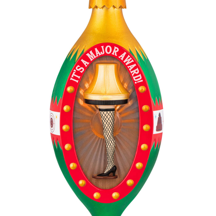 Christmas ornament with a decorative leg lamp with a festive border on a white background