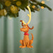 Max the Reindeer Dog ornament hanging on a Christmas tree