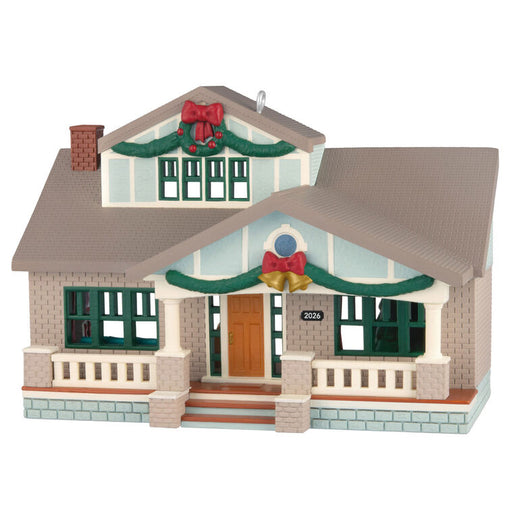 Christmas-themed house ornament with decorative elements on a white background