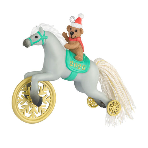 Decorative toy pony with a teddy bear rider wearing a Santa hat, on a white background