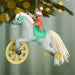 Decorative Christmas ornament with a toy pony and teddy bear, featuring the year 2026, hanging on a tree.
