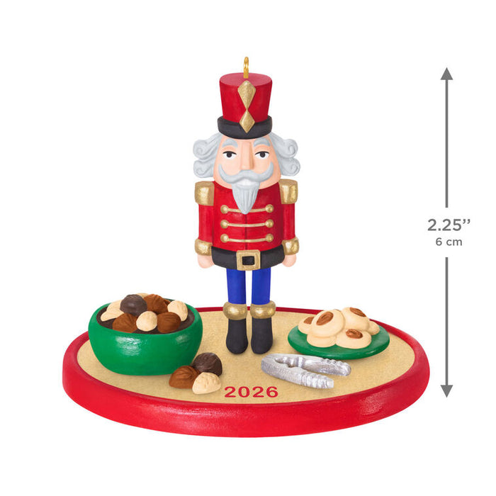 Christmas nutcracker figurine with a bowl of nuts and a measurement label on a white background