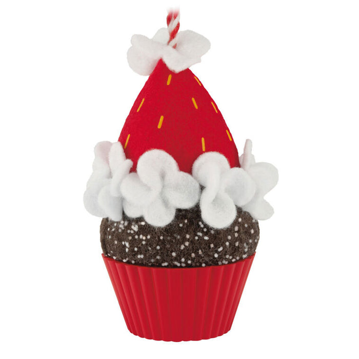 Decorative cupcake ornament with red and white icing, on a white background