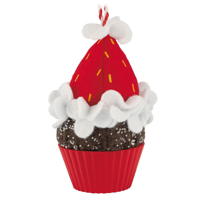 Decorative ornament shaped like a cupcake with red frosting on a white background