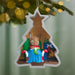Christmas tree-shaped ornament with a mouse character sitting in a chair, surrounded by festive decorations.