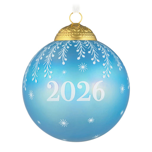 Blue Christmas ornament with '2026' and snowflake patterns on a white background