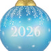 Blue ornament with '2026' and snowflake patterns on a white background