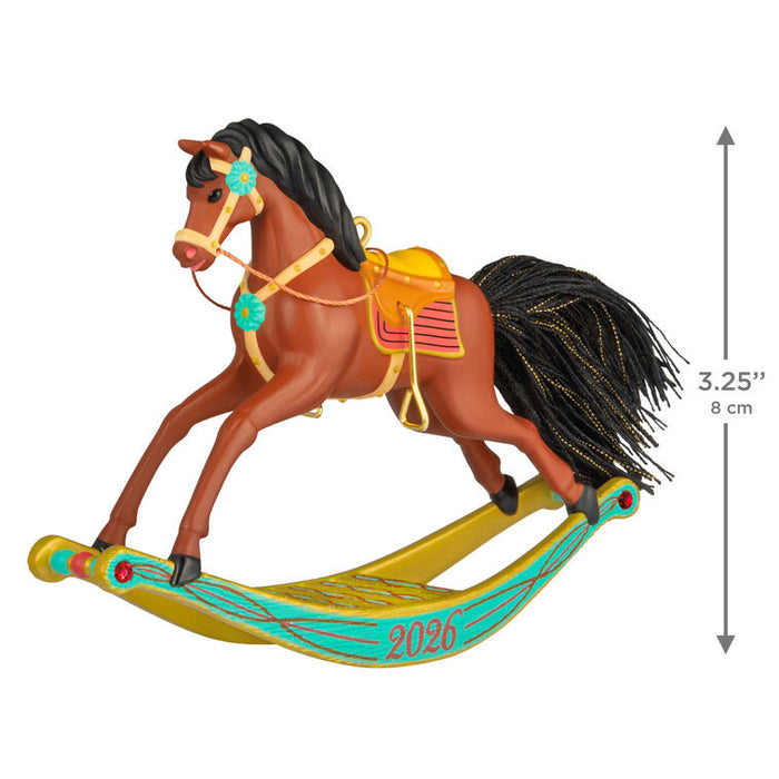 Colorful rocking horse ornament with measurements on a white background