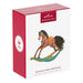 Hallmark Keepsake ornament packaging with rocking horse design on a white background