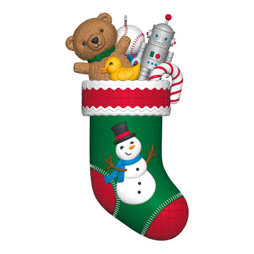 Christmas stocking with toys including a teddy bear, robot, and duck on a white background