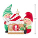 Decorative Christmas ornament with two gnomes and a gingerbread house, featuring a measurement indicator.