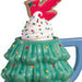 Green Christmas tree-shaped mug with a cookie on top against a white background