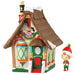 Decorative toy house with a small elf figure on a white background