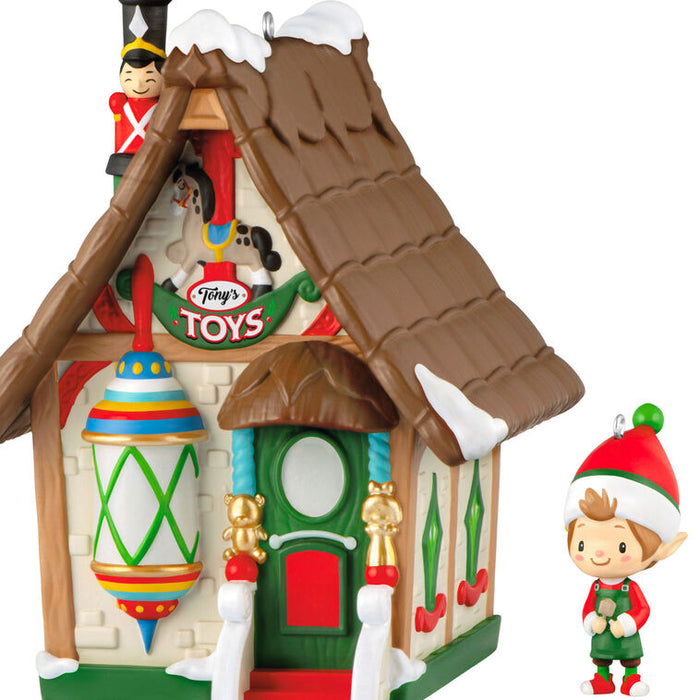 Toy store with 'Tony's Toys' sign and an elf figurine on a white background