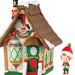Toy store with 'Tony's Toys' sign and an elf figurine on a white background