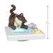 Cat figurine on a sink with water flowing, showing size measurement.