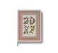 Decorative notebook with floral and geometric design on a white background
