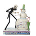 Skeleton character and snowman figurine with a candy cane on a white background