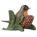 Bird figurine with a pine cone and leaves on a white background