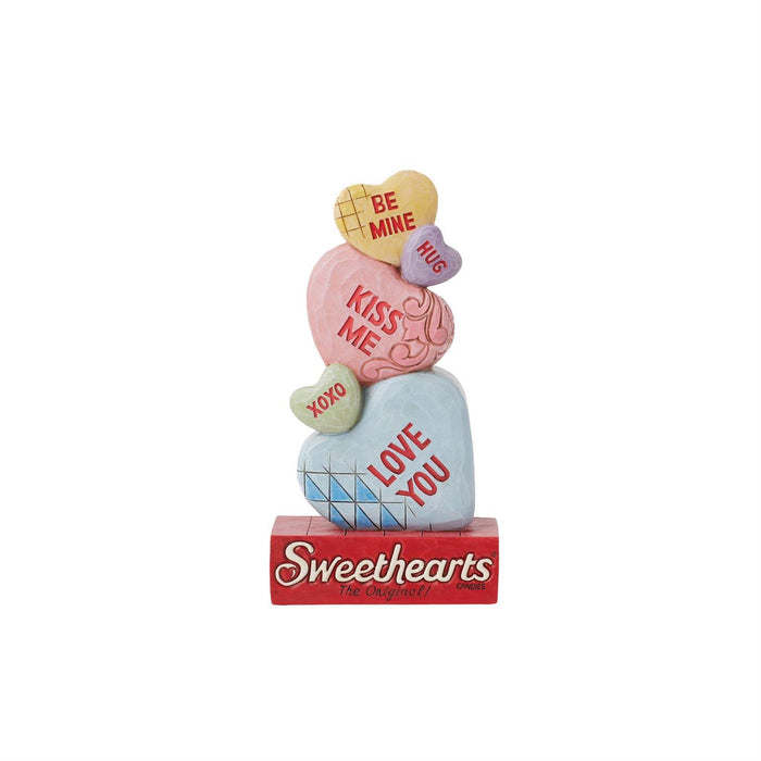 Decorative figurine with heart shapes and romantic phrases on a white background