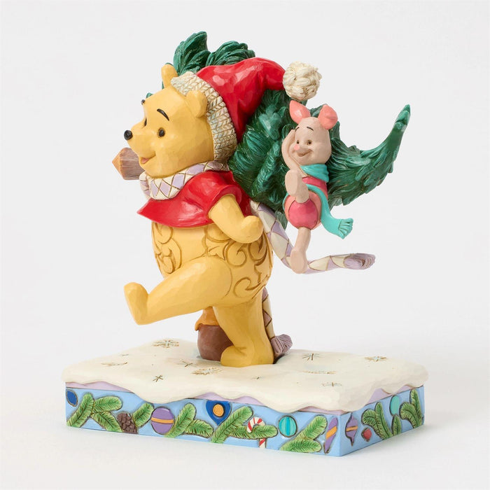 Figurine of Winnie the Pooh and Piglet with Christmas tree on a white background