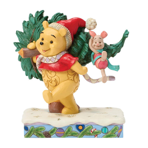 Figurine of Winnie the Pooh and Piglet with Christmas tree on a white background