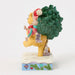 Figurine of Winnie the Pooh and Piglet with Christmas tree on a white background