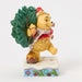 Figurine of Winnie the Pooh and Piglet with Christmas tree on a white background