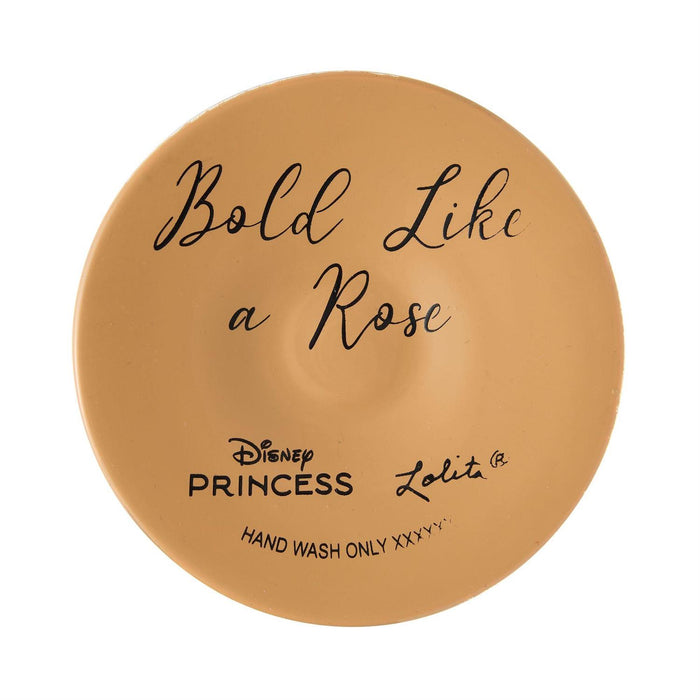 Round tan product with 'Bold Like a Rose' text and Disney Princess branding on a white background