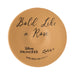 Round tan product with 'Bold Like a Rose' text and Disney Princess branding on a white background